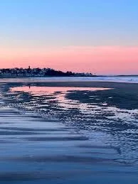 Sunset over the beach near The Oceanside Cuttery in Hull, MA